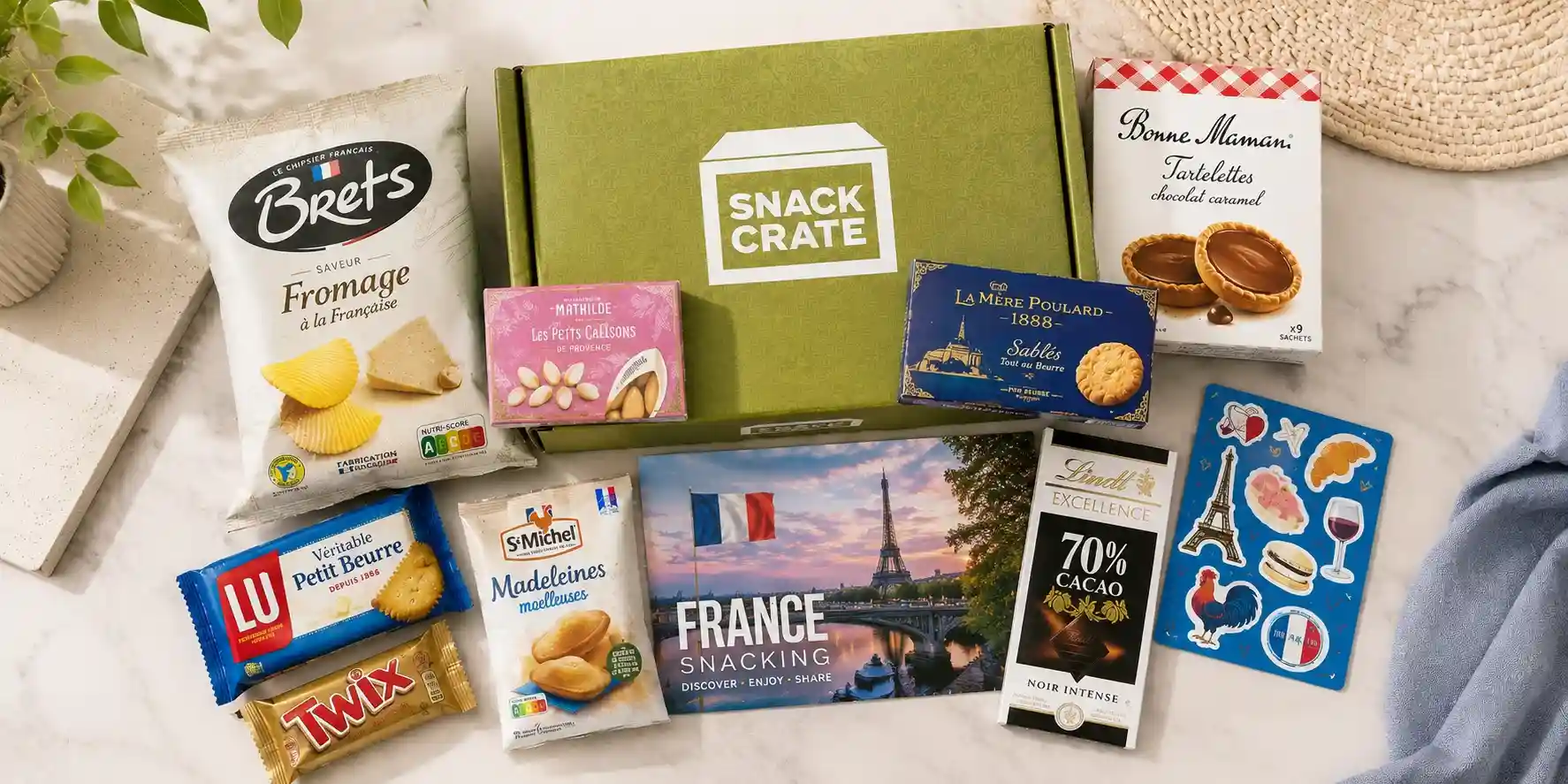 SnackCrate subscription box filled with imported French snacks and stickers