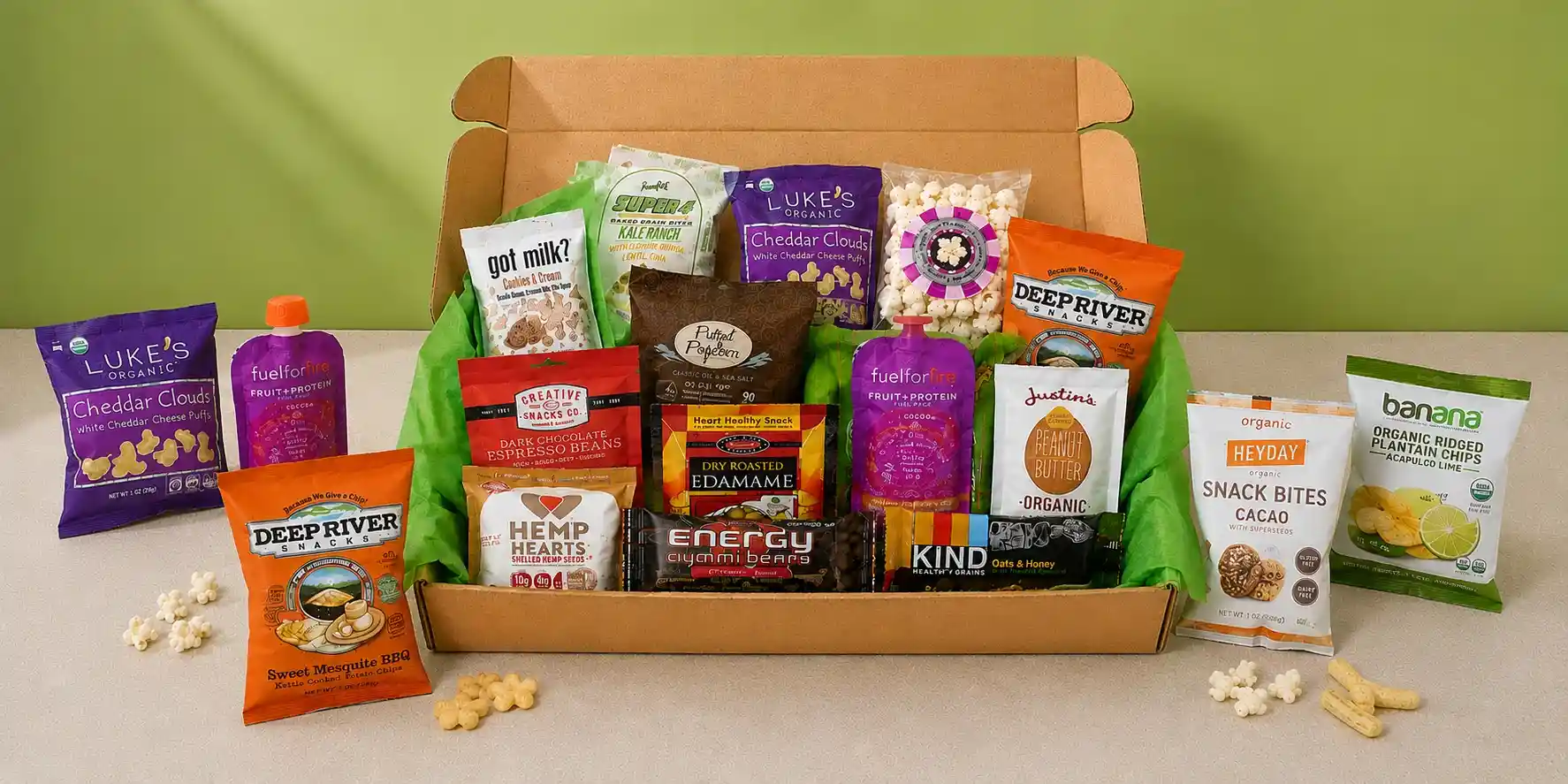 kraft UrthBox subscription box packed with organic snacks and green tissue paper